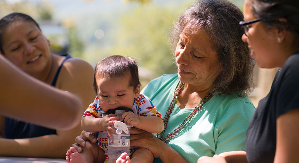 family with baby at table